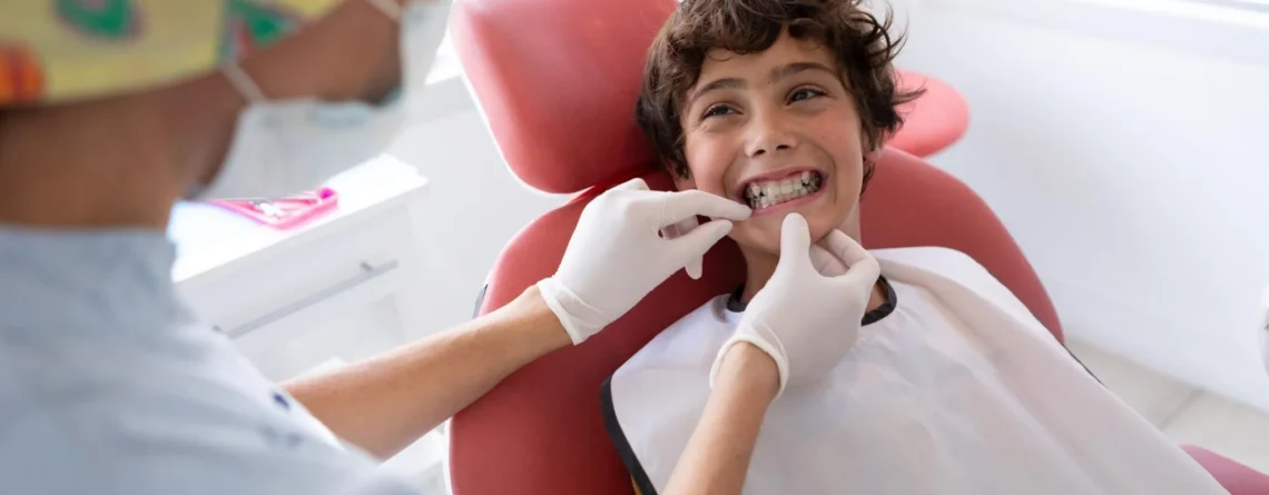 Child receiving an orthodontic consultation for braces at a dental clinic in Coquitlam.
