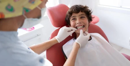 Child receiving an orthodontic consultation for braces at a dental clinic in Coquitlam.