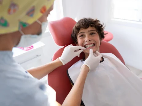 Child receiving an orthodontic consultation for braces at a dental clinic in Coquitlam.