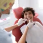 Child receiving an orthodontic consultation for braces at a dental clinic in Coquitlam.